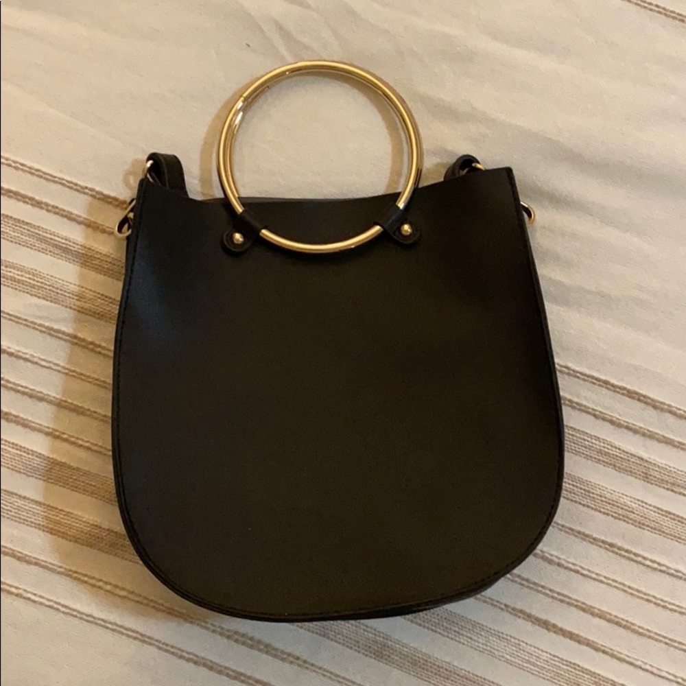 Crossbody bag with round handle
